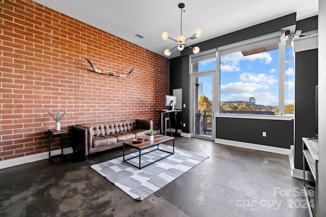 living room with a chandelier and brick wall