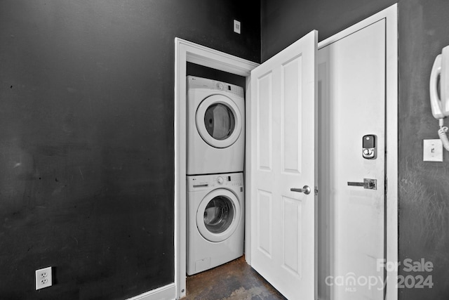 laundry area with stacked washer and clothes dryer