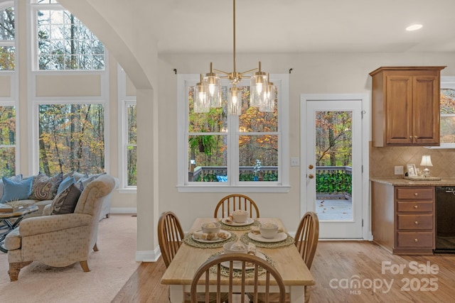 dining space featuring a healthy amount of sunlight and light wood-type flooring