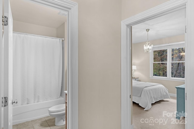 interior space featuring light tile patterned floors and a notable chandelier