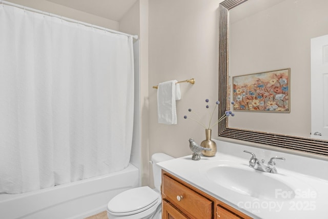 full bathroom featuring shower / bath combo with shower curtain, vanity, and toilet