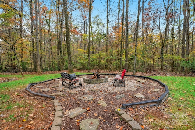 view of patio with a fire pit