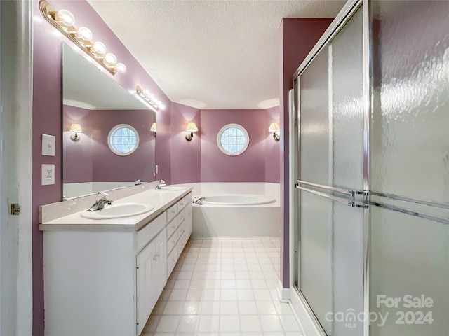 bathroom featuring vanity, plus walk in shower, and a textured ceiling