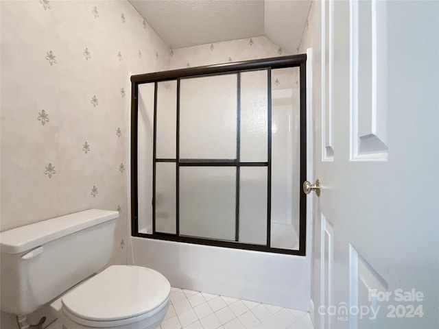 bathroom with enclosed tub / shower combo, a textured ceiling, toilet, and tile patterned flooring