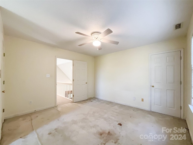 carpeted empty room with ceiling fan