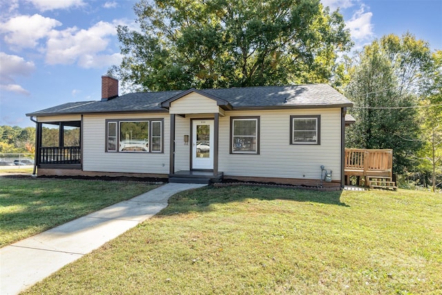 view of front of house featuring a deck and a front lawn