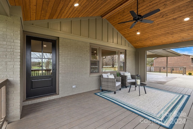 wooden terrace featuring ceiling fan and covered porch