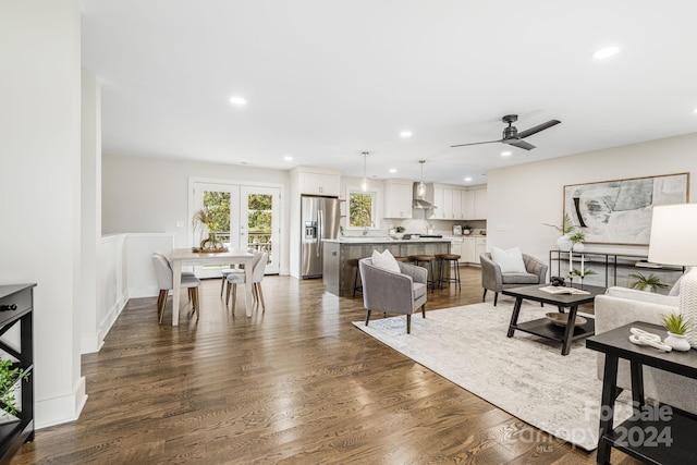 living room featuring french doors, dark hardwood / wood-style floors, and ceiling fan