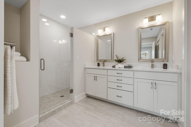 bathroom featuring vanity and walk in shower