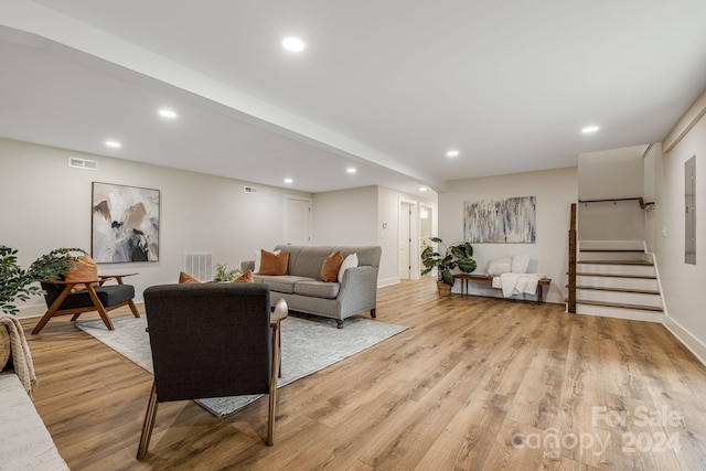 living room with light hardwood / wood-style flooring