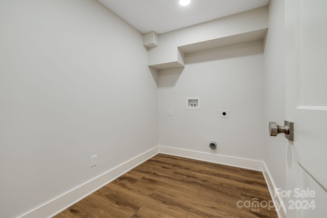 laundry area featuring hookup for an electric dryer, hookup for a washing machine, and dark wood-type flooring