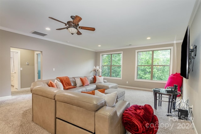 carpeted living room featuring ceiling fan and crown molding