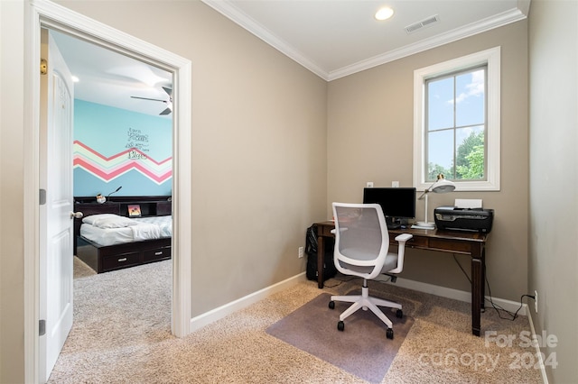 office space with ornamental molding, light carpet, and ceiling fan