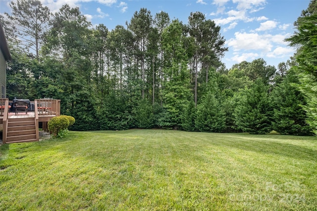 view of yard with a wooden deck