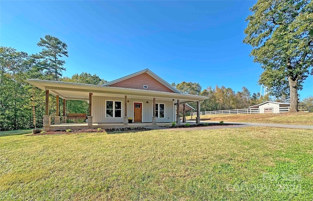 farmhouse with a front lawn and a porch