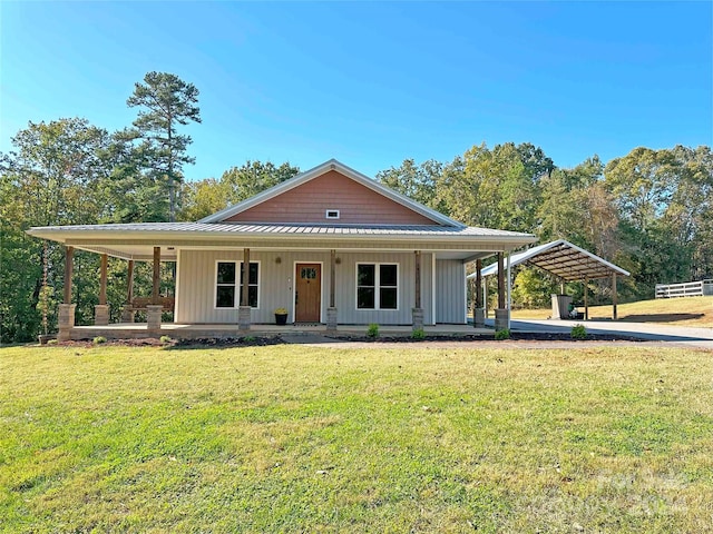 country-style home with covered porch and a front lawn