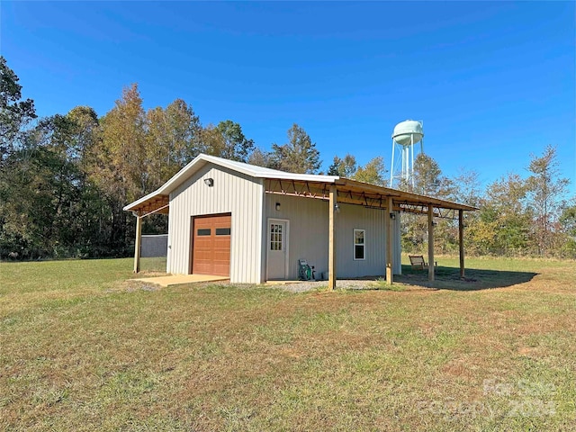 view of outbuilding with a garage and a lawn