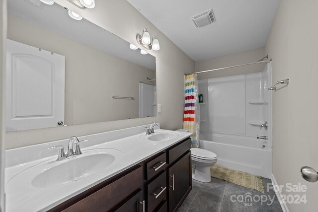 full bathroom with vanity, toilet, tile patterned floors, and shower / tub combo with curtain