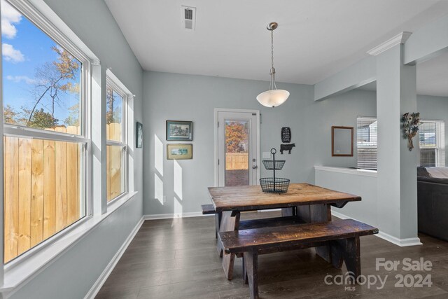 dining area featuring dark hardwood / wood-style floors