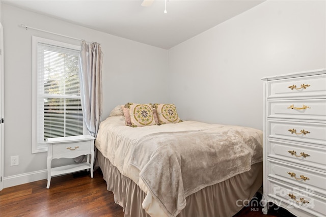 bedroom with ceiling fan and dark hardwood / wood-style flooring