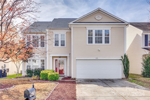 view of front of property with a garage