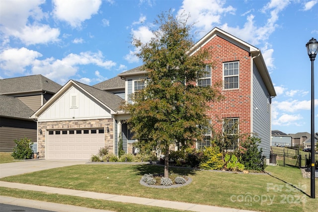 view of front of home featuring a front lawn and a garage