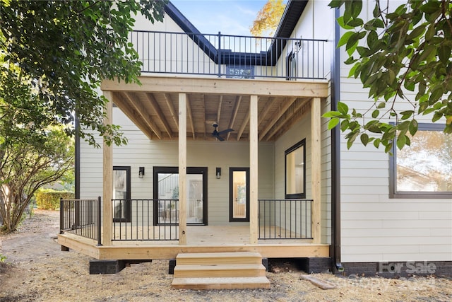 exterior space with ceiling fan