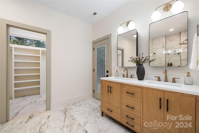 bathroom with a shower and vanity