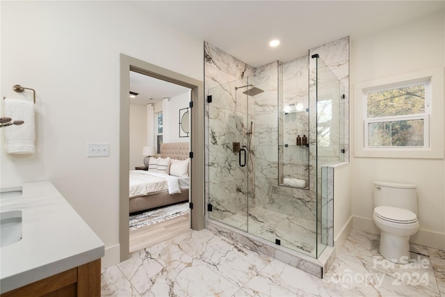 bathroom featuring vanity, an enclosed shower, and toilet