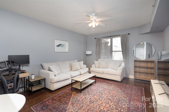 living room featuring ceiling fan and dark hardwood / wood-style flooring