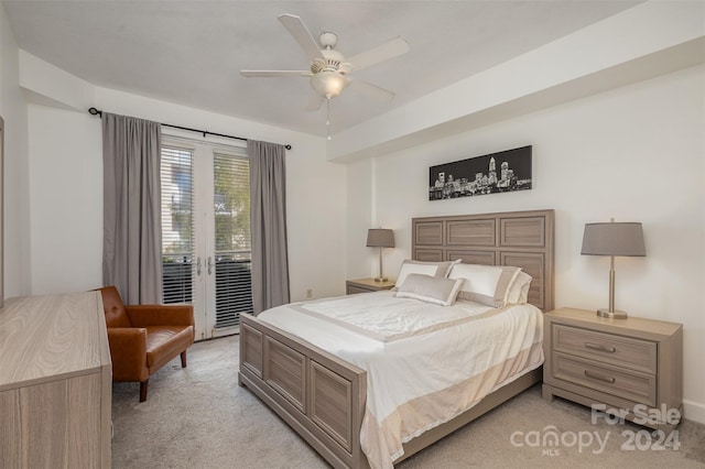 bedroom with ceiling fan, access to outside, and light colored carpet