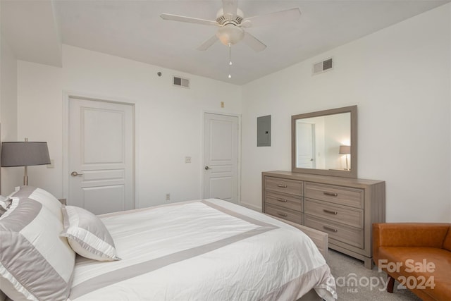 carpeted bedroom featuring ceiling fan and electric panel