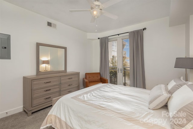 carpeted bedroom featuring electric panel and ceiling fan