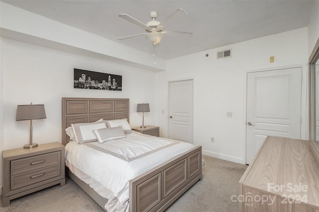 carpeted bedroom with a closet and ceiling fan