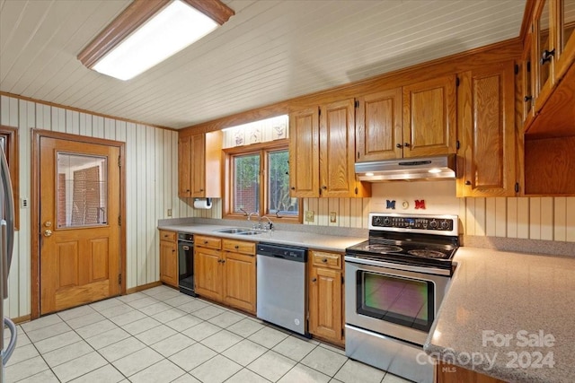 kitchen with sink, light tile patterned flooring, and stainless steel appliances