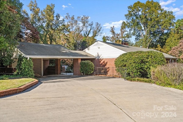 view of side of property featuring a carport