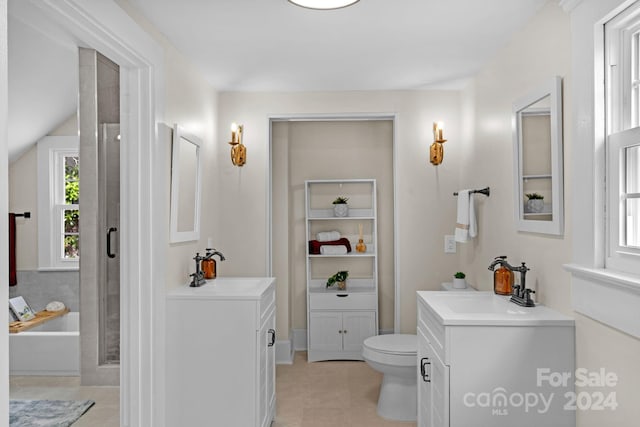 bathroom with vanity, toilet, and tile patterned flooring