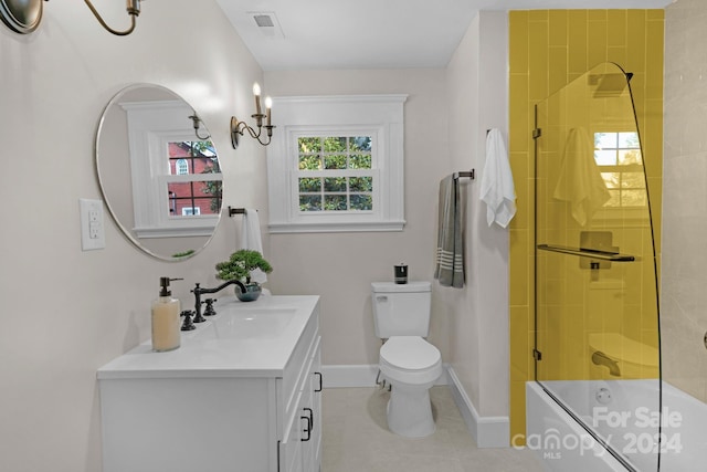 full bathroom with toilet, bath / shower combo with glass door, vanity, and tile patterned floors