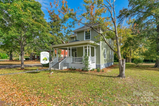 view of front of house featuring a front yard and a porch