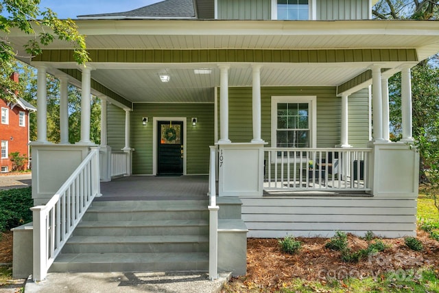 entrance to property featuring covered porch