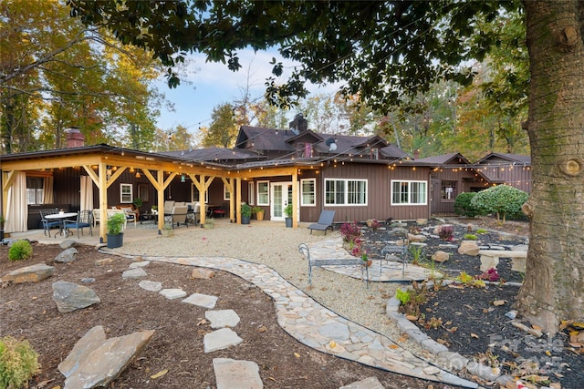 rear view of house featuring a patio