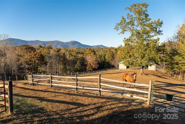 exterior space with a rural view and a mountain view