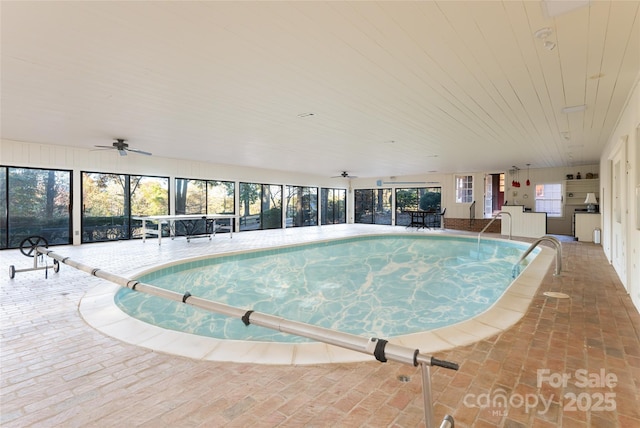 view of swimming pool featuring ceiling fan