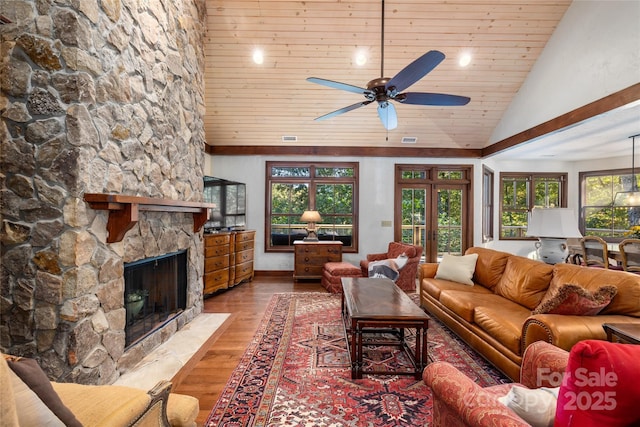 living room featuring french doors, wood ceiling, ceiling fan, a fireplace, and hardwood / wood-style floors