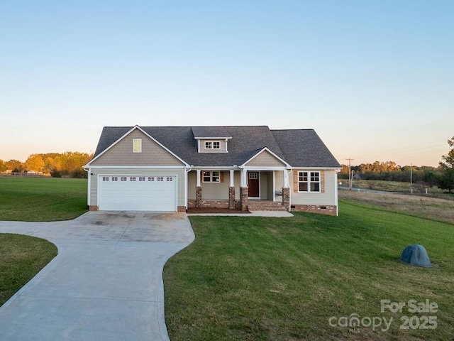 craftsman inspired home with concrete driveway, crawl space, a lawn, and an attached garage