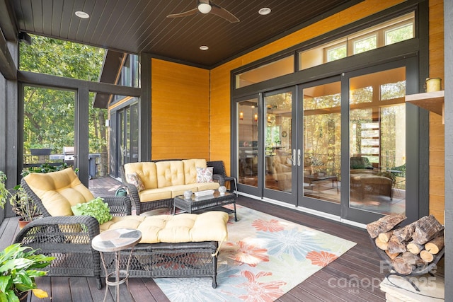 sunroom / solarium with wood ceiling and ceiling fan