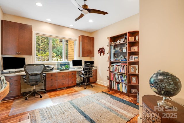 office area with ceiling fan and light hardwood / wood-style floors