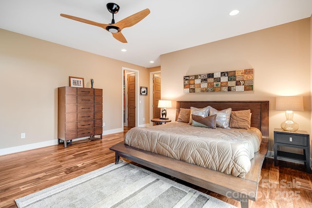 bedroom featuring recessed lighting, ceiling fan, baseboards, and wood finished floors