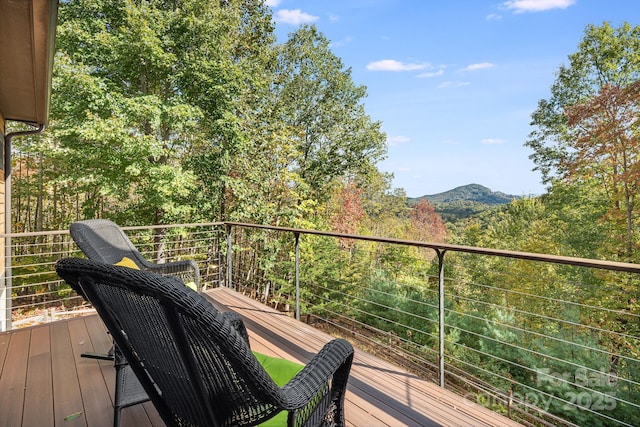 wooden deck featuring a mountain view