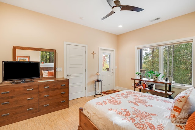 bedroom with ceiling fan and light hardwood / wood-style flooring